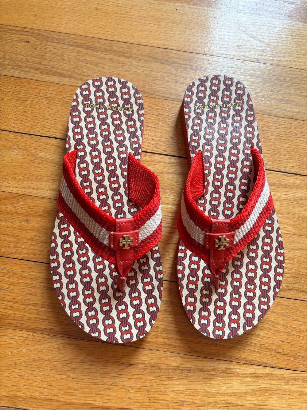 Tory Burch Red and White Striped Chain-Print Flip Flops with Gold Logo, size 6.
